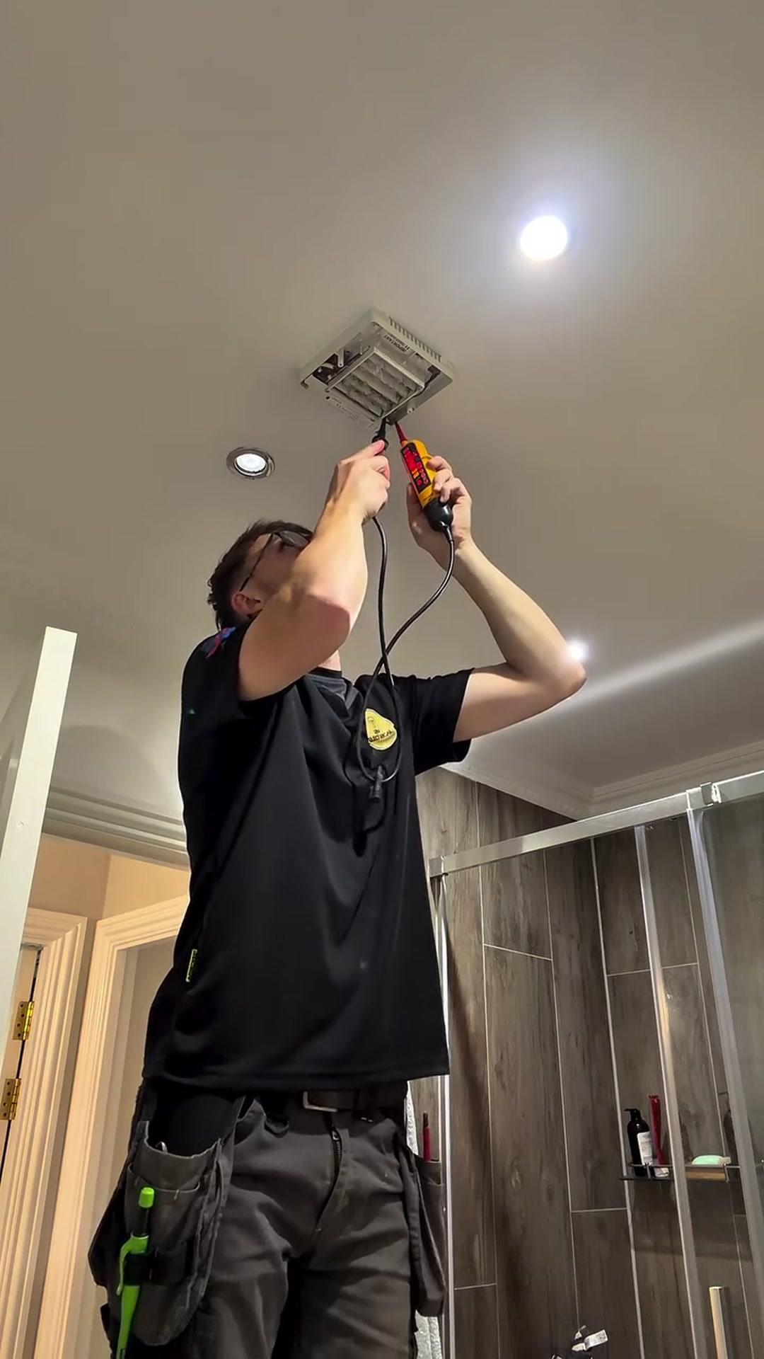 Ryan of RM Electrical fitting a downlight