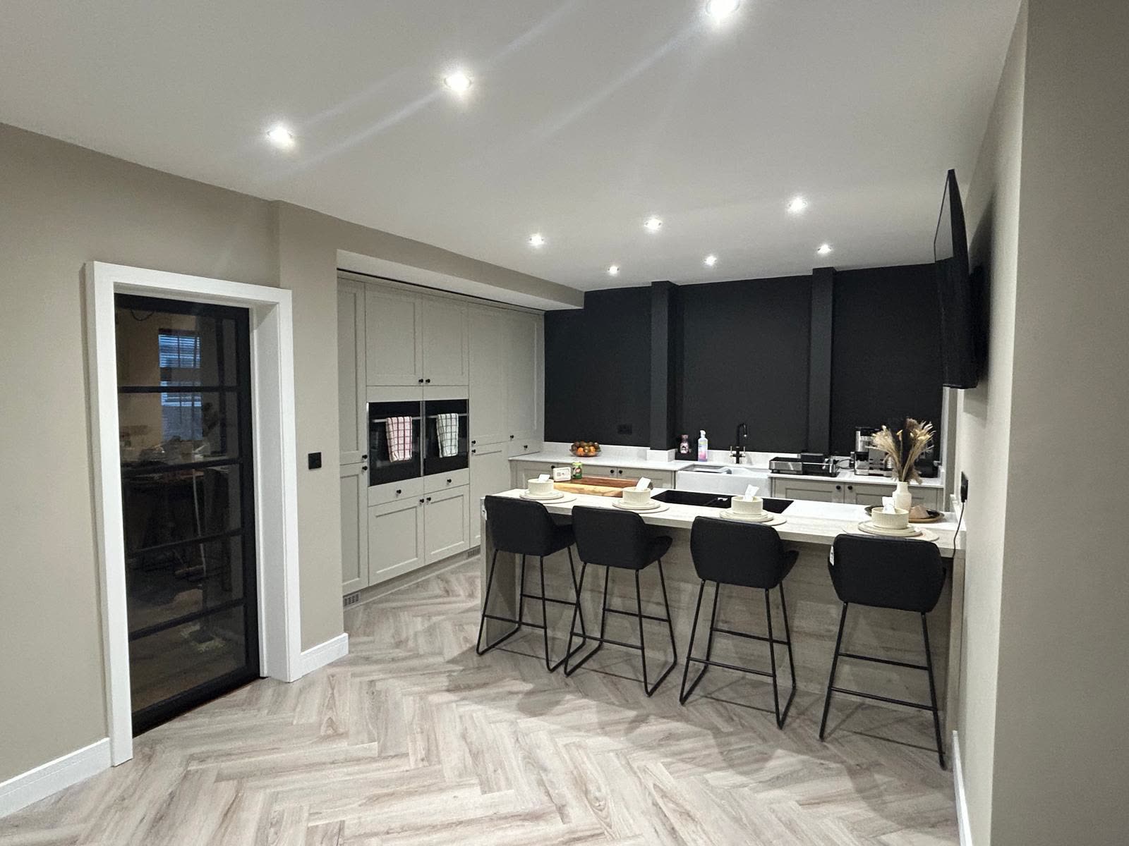 A finished kitchen lit with downlights, fitted by RM Electrical